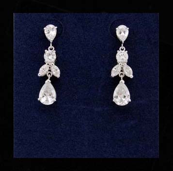 Earring wholesale product line supplied by online import dealer. Angel figure made from clear cz stone hanging from cz crystal stud          