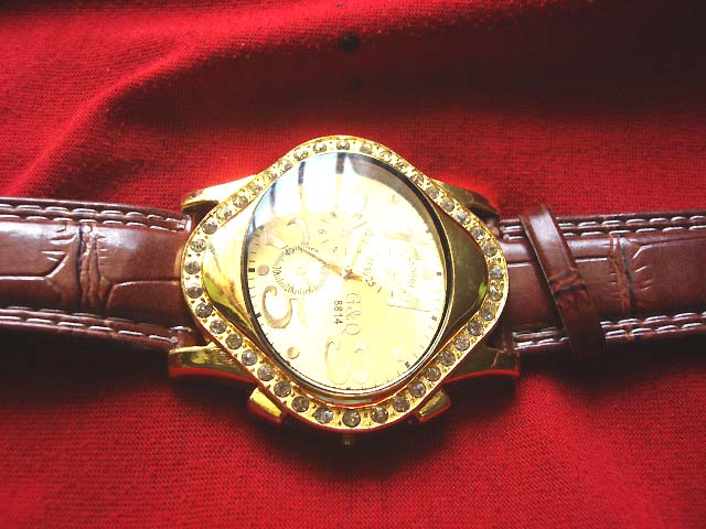 Wholesale G & Q style mens fashion watch with stone embedded gold frame and brown imitation leather strap supplier