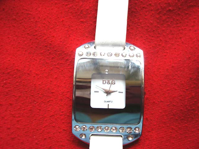 Solid silver framed watch with small cz stone on top and bottom and white strap - Direct supply jewelers