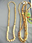 Ivory colored sculpted wood beads on ladies island necklace  from international resort wear collection wholesaler