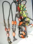 Hot beach wear supply outlet manufactures Black beaded coiled necklace with sculpted wooden beads in unique designs 