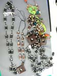 Resort apparel accessory shopping b2b trade wholesaler, Balinese art wear necklace with carved wooden charms and cylindrical wood beads 