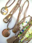 Exotic designer jewelry manufacturing supplier, Sculpted tribal wooden bali pendant on multi cord necklace 