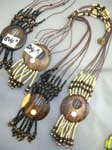 Traditional bali wear supply distributor exports Unique tribal wood pendant with seashell decor and beaded cord above and below on cord necklace 