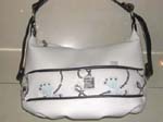 White leather ladies purse with butterfly pattern and silver shiny chips design 