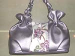 Shiny purple ladies purse with embroidery star and sparkle chips design