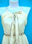 Beauty fashion wear clothing supply wholesale warehouse. Tan colored summer dress with thin straps, tie up top, sequin bodice, and decoratively stitched waist and hem