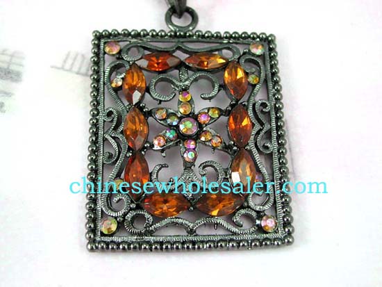 Cz gemstone jewelry online fashion wholesale dealer supplies Picture frame shape pendant with colored cz flower design at center surrounded by orange cz stones atop vine decor and has four multicolored cz gems in each corner..    
              
        