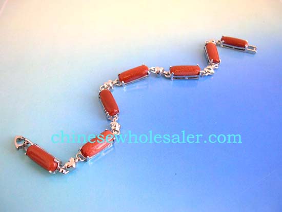 Silver jewelry wholesale supply store sells gemstone bracelets. Gold sand stone fashion bracelet in long shape connected with silver heart design and chain lock for closure    .    
              
        