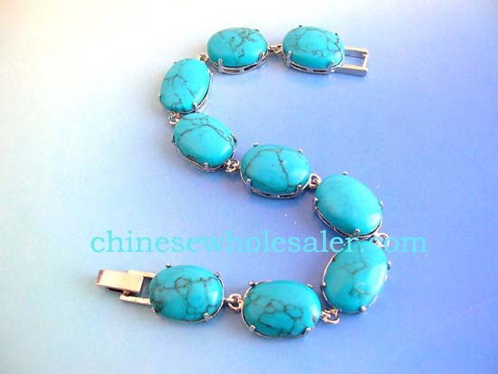 Wholesale precious gemstone jewelry distributor sells Turquoise fashion bracelet in oval shape with chain lock for closure    .    
              
        