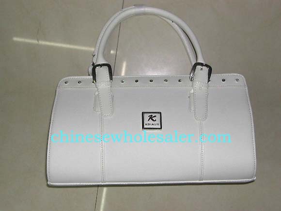 Buy designer inspired wholesale purses from online importing agent. White imitation leather handbag with double handles and gemstone studded lining along top     


   