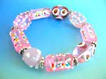 Handmade China import bracelet supplied for reatil sale. Fashion stretchy pink bracelet with multi red white hand-painted Chinese lampwork glass bead and flat silver beads design
