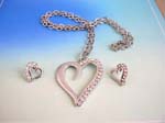 Heart cz jewelry set wholesalers distributing gemstone jewelry. Heart love shape frame pendant suspended on a snake chain, included a matching a set of studs earrings