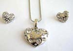 Wholesale costume jewelry sets with earings and necklace . Heart shape pendant with clear cz inlaid, suspended on a snake chain, included a matching pair of post back earrings