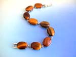 Gemstone jewelry supplier sell online wholesale products. Tigers eye fashion bracelet in round shape with S lock for closure