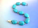 Wholesale precious gemstone jewelry distributor sells Turquoise fashion bracelet in oval shape with chain lock for closure