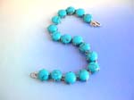 Fashion turquoise jewelry supplied at wholesale price. Turquoise gemstone jewelry from China manufacturer supply Tigers eye fashion bracelet in round shape with S lock for closure