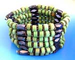 Magnetic health products supplied wholesale by China importer. Green wooden beads, flower shaped silver beads and multi faceted cylinder hematite beads. Wear as necklace, bracelet, or arm band