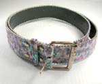 Fun, flirty belts supplied wholesale from China distributor. Lady belt with glittery green and blue dots on top of purple and pink base. Siver beads outline belt and make up buckle.