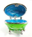 Enamel jewelry box motif an egg shape with blue double heart pattern in green color