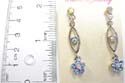 Fashion studs earring motif leaf shape holding a blue cz and connecting a blue cz flower at the bottom