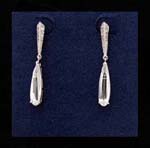 Import gemtone earrings wholesale for discount prices. Elongated rain drop cz chrystals hang below rhodium plateddiamond shape