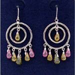 Wholesale jewelry direct store distributes cz fashions. Gyspy styled earings with cut out circle within another and yellow cz stone at center. Green, pink, and yellow cz stones hang beneath larger circle.