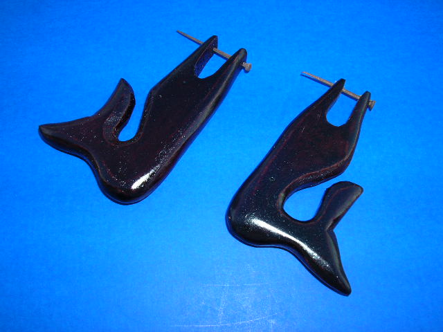 Fish tail inspired fashion earrings crafted from organic wood. Outsoucing accessory dealer