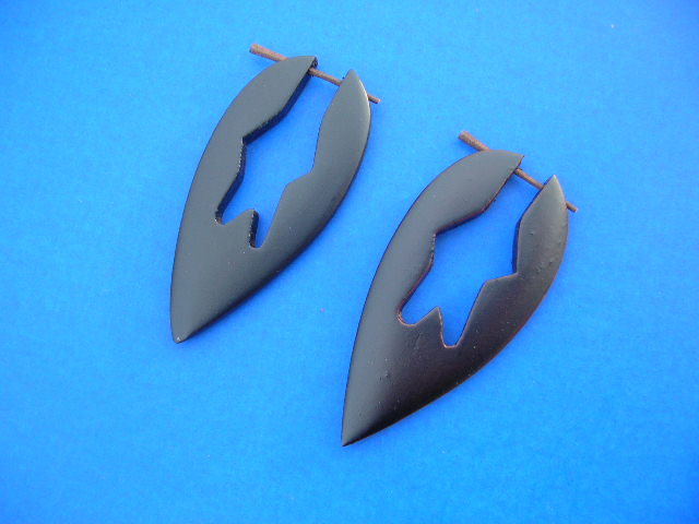 Retail gift warehouse. Arrow head design organic wood earrings with star shape in center