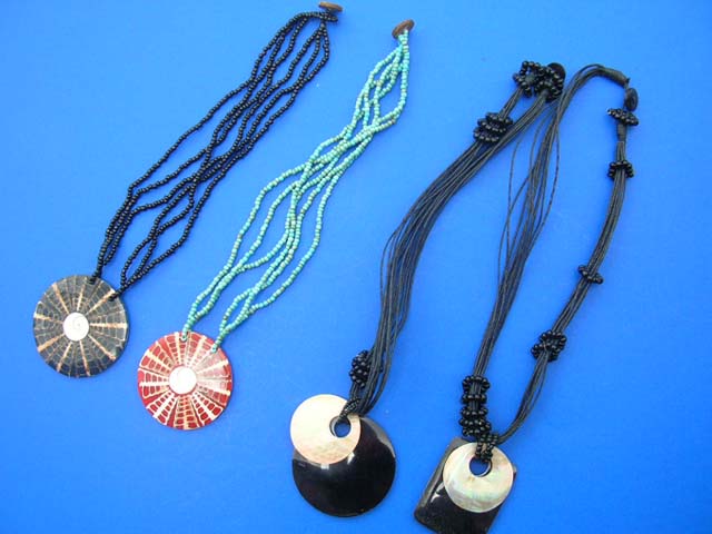 Balinese export supplies - Handcrafted seashell pendant suspended from multi string bead necklace
