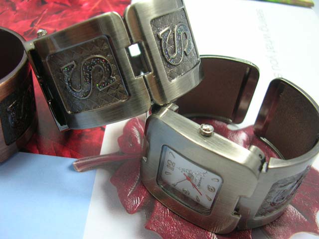 Gift sourcing outlet - Capital lettering motif on wide bangle bracelet watch with squared clock face 
