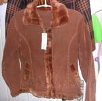 Dark brown color lady's imitation leather long coat; faux fur lined along at bottom;neck and zipper part; two pocket; zipper-up front closure