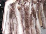 Brown faux leopard fur jacket with long sleeve; hidden zipper-up front closure