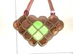 Imitation leather chips handbag with diamond shape and small green diamond shape in the center