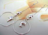 Enamel 925. sterling silver beaded French hook style earring with circle holding a dolphin