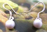 Sterling silver earring with a white pearl bead suspending, fish hook back 