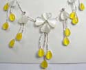 Fashion white cat eye beads dangling earring paired with silver plated necklace holding white cat eye beads flower and yellow cat eye beads dangle hanging 