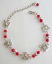 Fashion bracelet with multi imitation coral and silver butterfly beads in lobster claw clasp