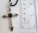 Fashion necklace with black twisted cord string holding a cross with arrow edges and black enamel design at center
