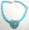 Fashion necklace with multi blue strings with heart shape blue cat eyes embedded heart shape pendant. Lobster claw clasp