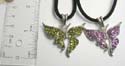 Fashion butterfly pendant necklace with multi mini cz stone embedded. Black thick cord string and lobster clasp. Randomly pick
