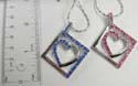 Necklace fashion silver plated holding a cut-out heart pendant in a square shaped design, multi cz synthetic stone embedded on one side