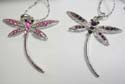 Fashion necklace with silver plated chain, holding dragonfly pendant with multi cz stone embedded on the body and wings