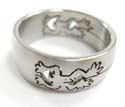 Surgical steel fashion ring with cut-out and carved-in frog design on two sides