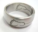 Carved-in foot print with a line connect together fashion surgical steel ring