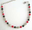 Fashion beaded bracelet in combination of imitation coral / onyx beads and Celtic silver beads with lobster claw clasp closure